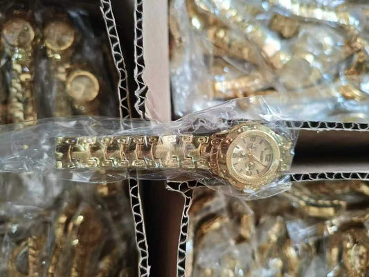 small gold watch