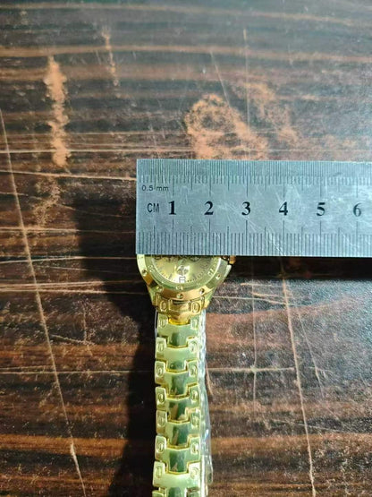 small gold watch