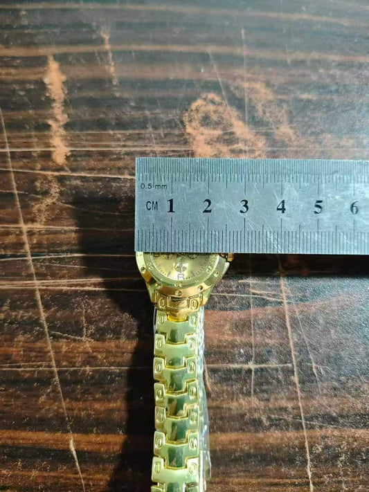 small gold watch